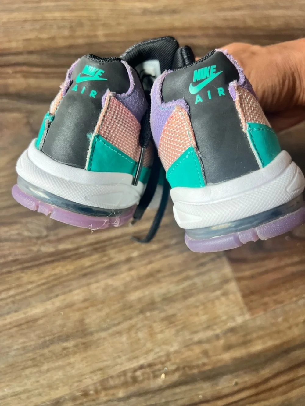 Nike Kids Black Sneakers with Purple Trim and Teal Logo